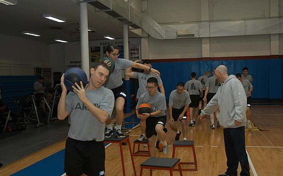 Second Infantry Division soldiers take part in physical fitness training Nov. 7, 2012, at Camp Red Cloud in South Korea. The Army this month reinstituted physical fitness standards required for participation in professional military education courses.