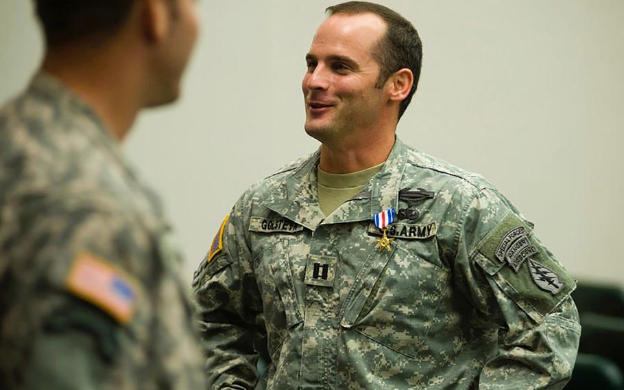 Then-Army Capt. Mathew Golsteyn is congratulated following a Valor Awards ceremony for 3rd Special Forces Group at Fort Bragg, N.C., on Jan. 4, 2011.