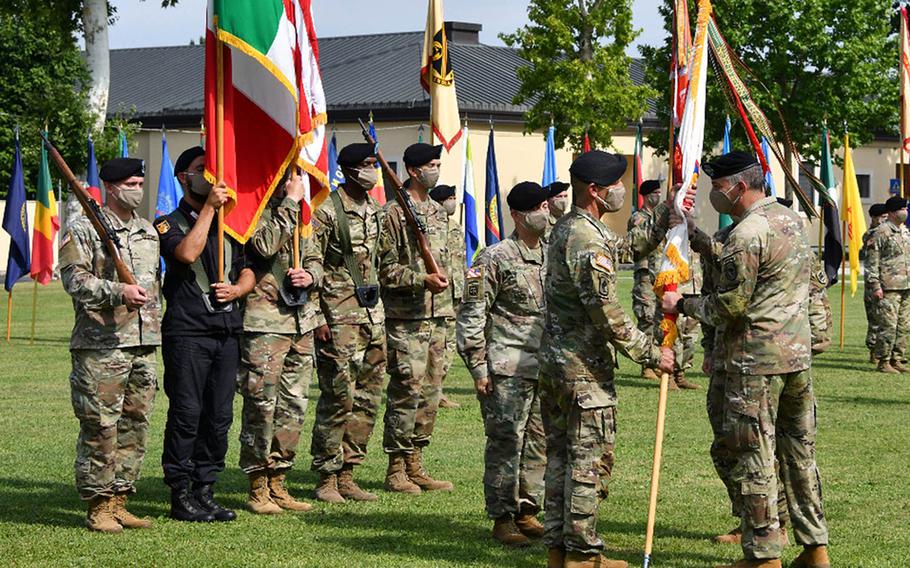 Army Gen. Stephen Townsend, right, commander of U.S. Africa Command, passes the U.S. Army Africa command guidon to Maj. Gen. Andrew M. Rohling, the incoming USARAF commander, during a socially distanced change of command ceremony July 15, 2020, at Caserma Ederle in Vicenza, Italy.