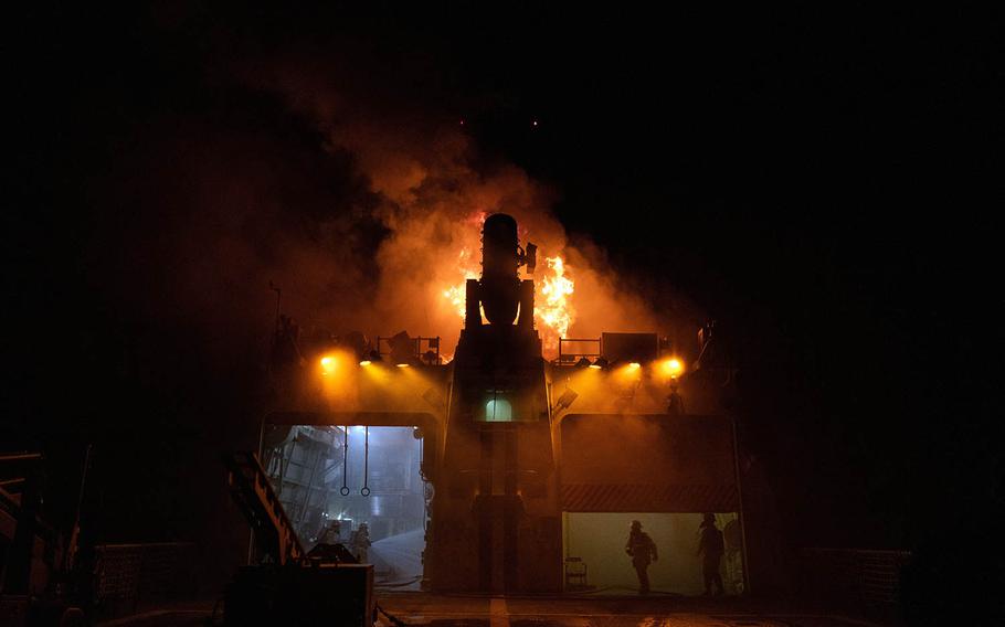 Fire teams battle a blaze aboard the Coast Guard cutter Waesche in the western Pacific Ocean, Sept. 19, 2020.