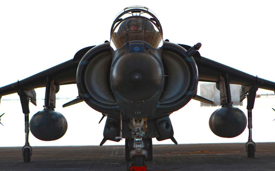 An AV-8B Harrier jet from Marine Attack Squadron 211 lands at Camp Bastion, Afghanistan, July 1, 2012.