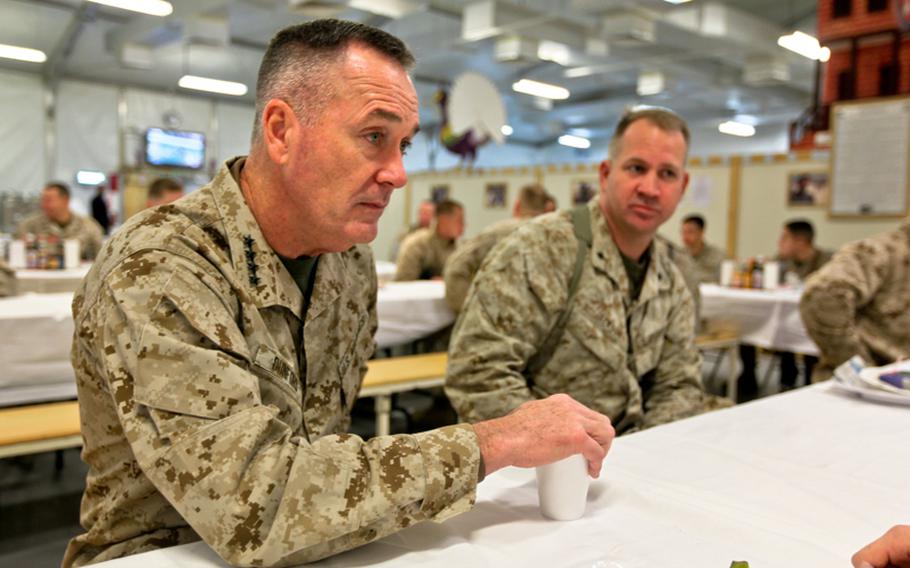 Gen. Joseph F. Dunford Jr., the assistant commandant of the Marine Corps, enjoys breakfast with Marines on Christmas morning at Camp Leatherneck, Helmand province, Dec. 25, 2011.