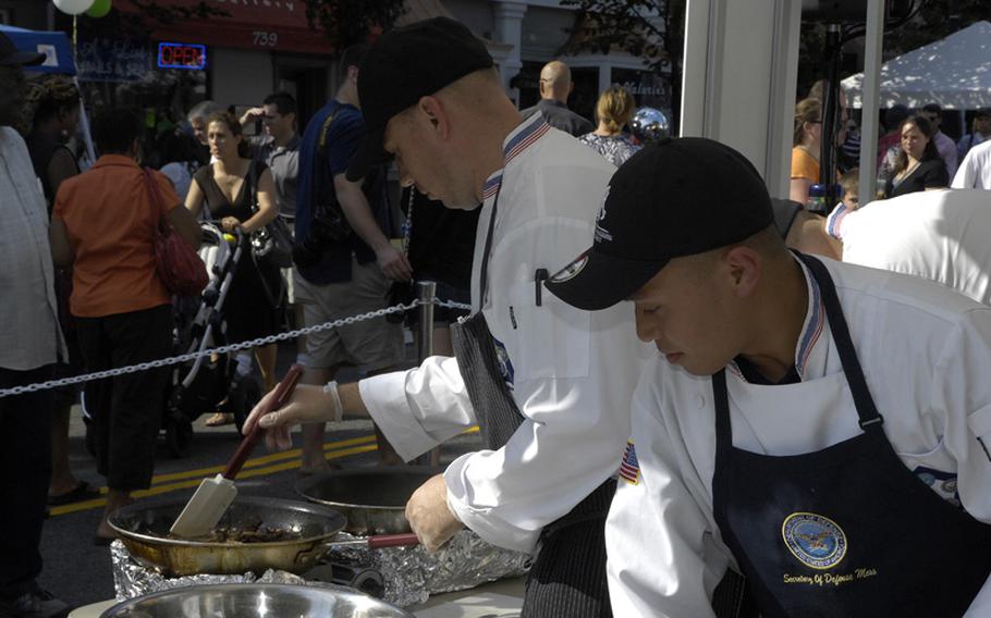 Members of the Office of the Secretary of Defense Pentagon Joint Team prepare a meal in the final round of the 2012 Military Culinary Competition in Washington, D.C., on Sept. 22, 2012. The team took 2nd place in the competition. From left are Army Sgt. Edward Windhurst and Air Force Staff Sgt. Ghil Medina.