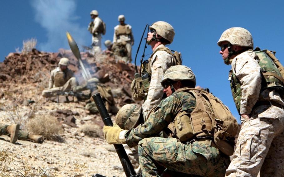 Students at the Infantry Officers’ Course fire a mortar round during a mountain attack in the Bullion Training Area at Twentynine Palms, Calif., March 21, 2012.