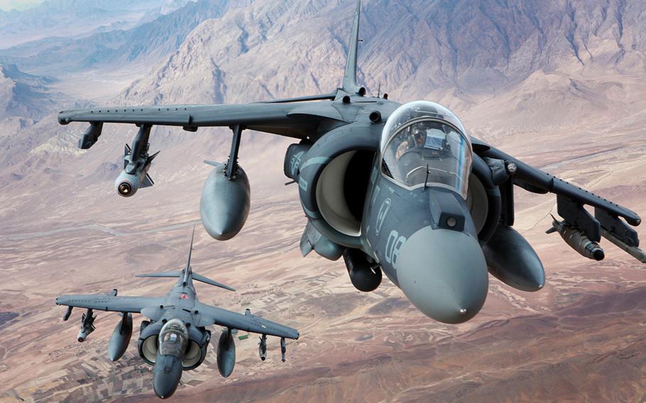 Marine AV-8B Harrier pilots fly over the southern Helmand province of Afghanistan on Dec. 6, 2012.