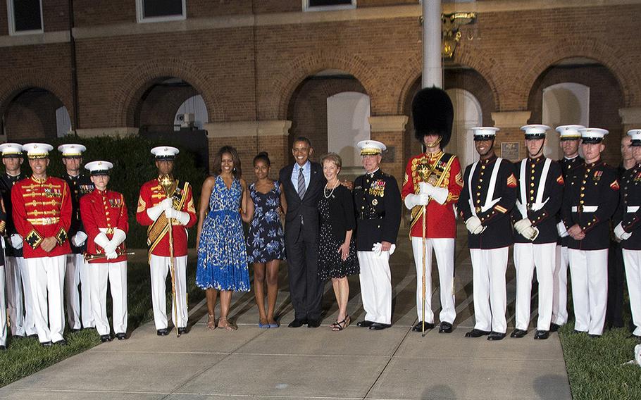 Dignitaries and Marines pose for a group photo after the evening parade at Marine Barracks Washington, June 27, 2014.