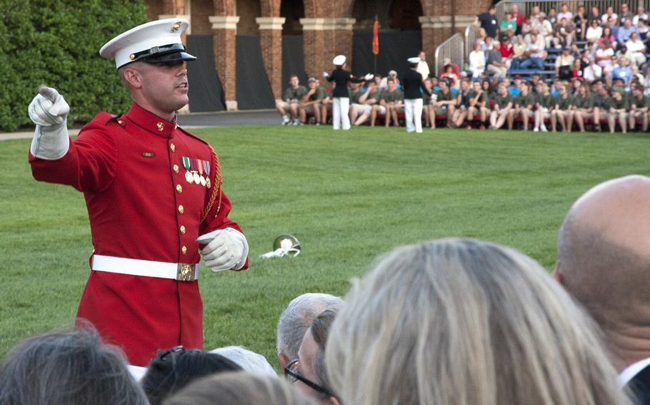 Marines give visitors some background details before the evening parade at Marine Barracks Washington, June 27, 2014.