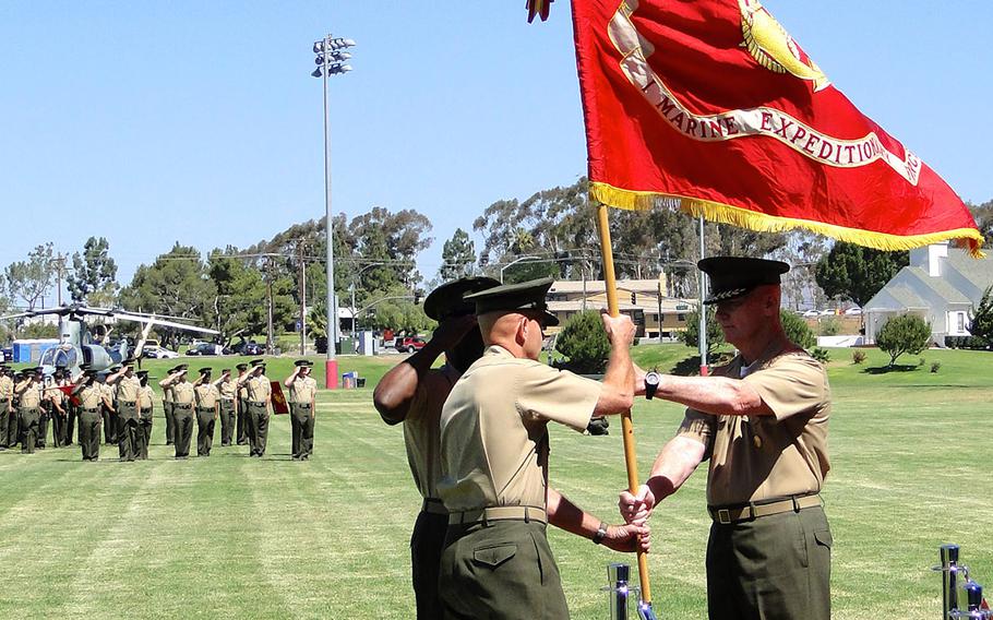 Lt. Gen. David Berger takes the flag of I Marine Expeditionary Force from Lt. Gen. John Toolan on Friday, as Berger took command of the unit at a ceremony at Camp Pendleton, Calif.