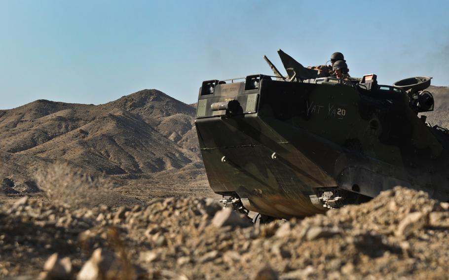 An amphibious assault vehicle maneuvers over rocky terrain at the Marine Corps Air Ground Combat Center on June 9, 2012, in Twentynine Palms, Calif.
