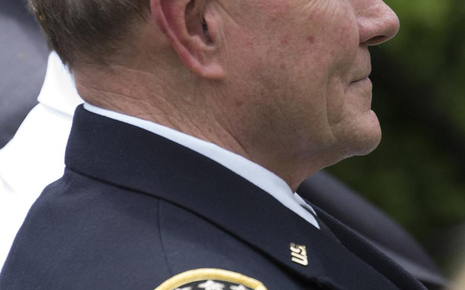 Chairman of the Joint Chiefs of Staff Gen. Martin Dempsey listens as President Barack Obama nominates Gen. Joseph Dunford to be Dempsey's successor during a Rose Garden ceremony, May 5, 2015.