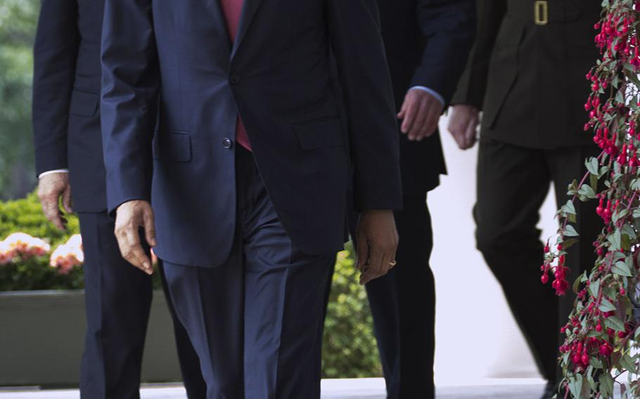 President Barack Obama arrives at a Rose Garden ceremony on May 5, 2015, followed by Vice President Joe Biden, Secretary of Defense Ash Carter and Joint Chiefs of Staff chairman nominee Gen. Joseph Dunford.