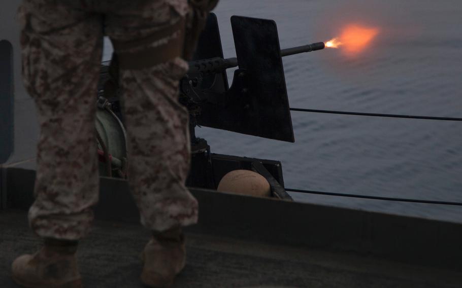 Marines with Company C, 3rd Platoon, of the Fleet Anti-Terrorism Security Team fire the .50 caliber gun during a live-fire exercise aboard the afloat forward staging base USS Ponce, Sept. 17, 2015.  FAST trains to provide quick-reaction reinforcement of security at U.S. naval and national assets, including U.S. embassies, for a limited duration.   