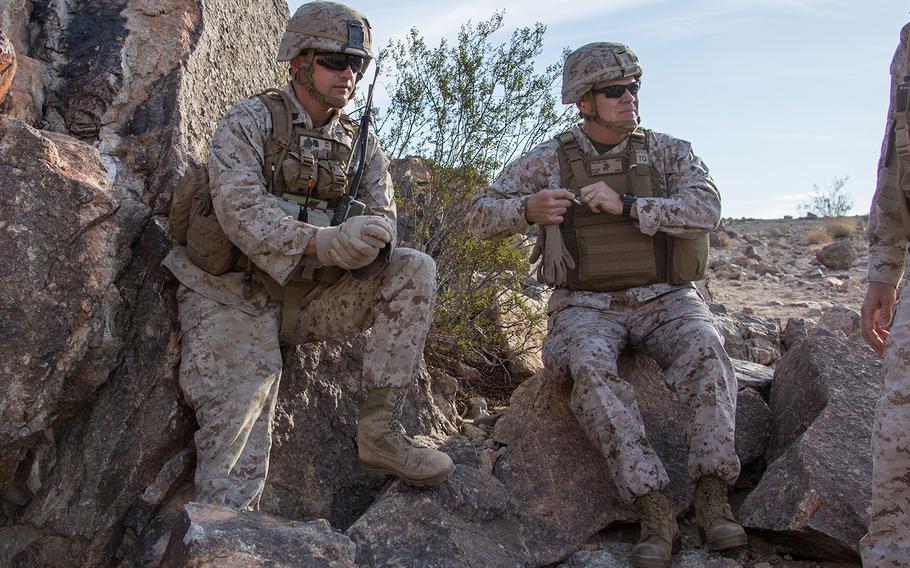 Commandant of the Marine Corps Gen. Robert B. Neller, right, sits with a Marine at Marine Corps Air Ground Combat Center Twentynine Palms, Calif., Nov. 7, 2016.