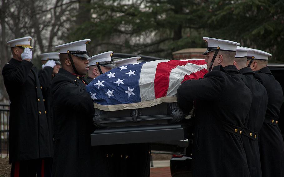 Marines prepare to carry Maj. Gen. Paul A. Fratarangelo to his final resting place at Arlington National Cemetery on Jan. 16, 2018.