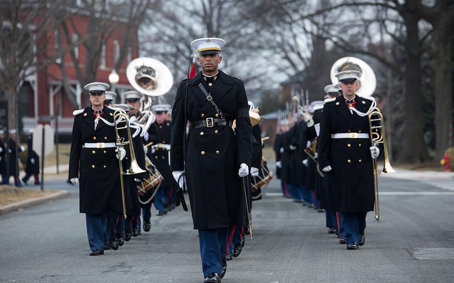 Capt. Ryan Davis, funeral staff marcher with Headquarters and Service Company, Marine Barracks Washington D.C., marches at the front of a formation during a full honors funeral for Maj. Gen. Paul A. Fratarangelo at Arlington National Cemetery, Arlington, Va., Jan. 16, 2018. 