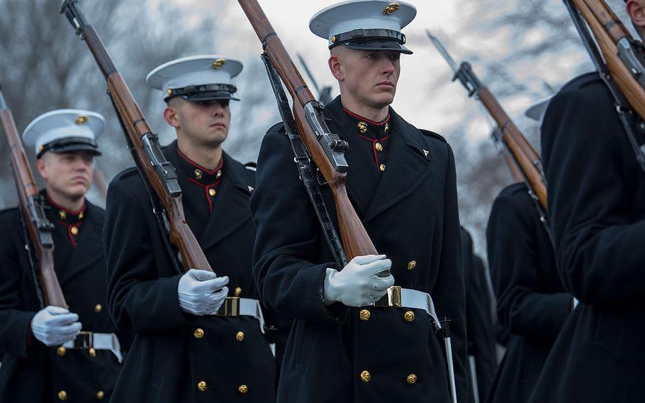 Marines with Alpha Company, Marine Barracks Washington D.C., march in formation during a full honors funeral for Maj. Gen. Paul A. Fratarangelo at Arlington National Cemetery, Arlington, Va., Jan. 16, 2018. 