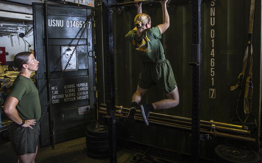 U.S. Marines with the Female Engagement Team, 26th Marine Expeditionary Unit, participate in a pull-up competition aboard the amphibious assault ship USS Bataan during Amphibious Ready Group, MEU exercise at sea on Sept, 4, 2019.