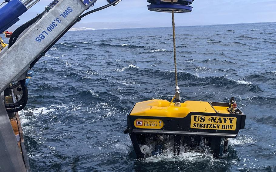 Undersea Rescue Command deploys the Sibitzky Remotely Operated Vehicle from the deck of the Military Sealift Command-chartered merchant vessel HOS Dominator in the Pacific Ocean, August 3, 2020, during recovery efforts for the missing seven Marines and one sailor from the 15th Marine Expeditionary Unit.