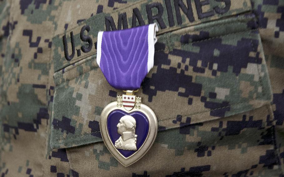 Marine Capt. Kevin Leishman, anti-terrorism force protection officer for the 3rd Marine Expeditionary Brigade, received the Purple Heart at Camp Courtney, Okinawa, Wednesday, Feb. 24, 2021, 16 years after he was shot during the Second Battle of Fallujah in Iraq.