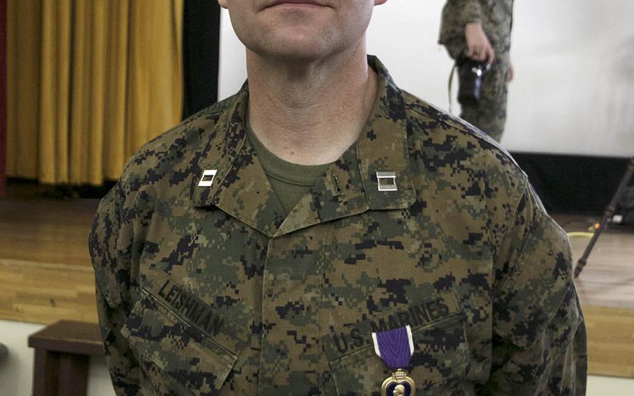 Marine Capt. Kevin Leishman, anti-terrorism force protection officer for the 3rd Marine Expeditionary Brigade, received the Purple Heart at Camp Courtney, Okinawa, Wednesday, Feb. 24, 2021, 16 years after he was shot during the Second Battle of Fallujah in Iraq.