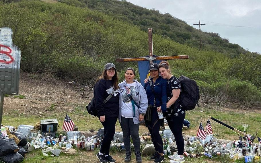 Mothers of some of the men who died in the July 30, 2020, assault amphibious vehicle accident visit a memorial to Petty Officer 3rd Class Christopher Gnem, a Navy hospital corpsman, on Camp Pendleton, Calif., in March 2021. From left: Aleta Bath, mother of Marine Pfc. Evan Bath; Lupita Garcia, mother of Lance Cpl. Marco Barranco; Nancy Vienna, mother of Gnem; and Christiana Sweetwood, mother of Lance Cpl. Chase Sweetwood. 