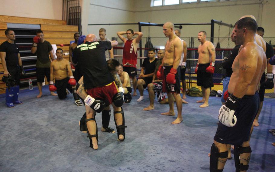 Marines work on their mixed martial arts skills during training last year in Okinawa. A policy letter from the III Marine Expeditionary Force and Marine Corps Installations Pacific Policy outlines the steps Marines and sailors must follow in order to participate in off-duty mixed martial arts events.