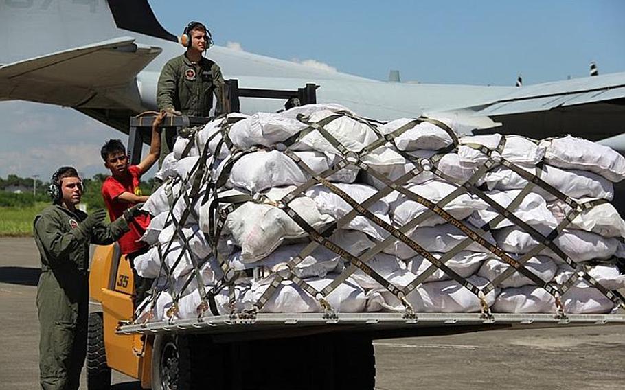 A Marine Corps KC-130J Hercules carrying relief goods from Manila arrives in Davao City. U.S. Marine Forces Pacific Command has sent personnel and supplies to transport humanitarian assistance and disaster relief.

