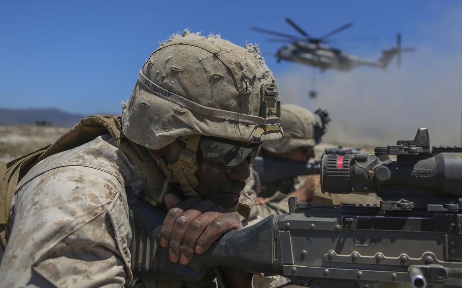 Cpl. Kamen Pinkey, a motor transportation operator assigned to Company A, 1st Battalion, 11th Marine Regiment, 1st Marine Division, posts security for a CH-53E Super Stallion aboard Marine Corps Base Camp Pendleton, Calif., on June 17, 2015.