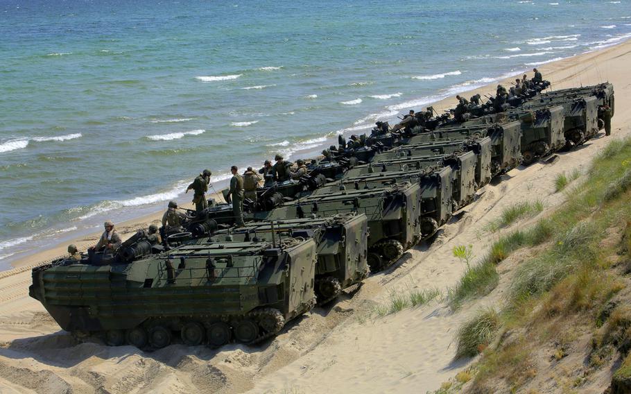 An international corps of marines from Sweden, Finland, and the U.K. conduct amphibious assaults on a beachhead in Ravlunda, Sweden, for local media outlets during BALTOPS 2015, on June 13, 2015. The amphibious forces are part of 17 NATO Allies and partner nations that are integrated in air, land, and sea operations to improve their combined-force capability to work together and to respond to threats in the Baltic region.