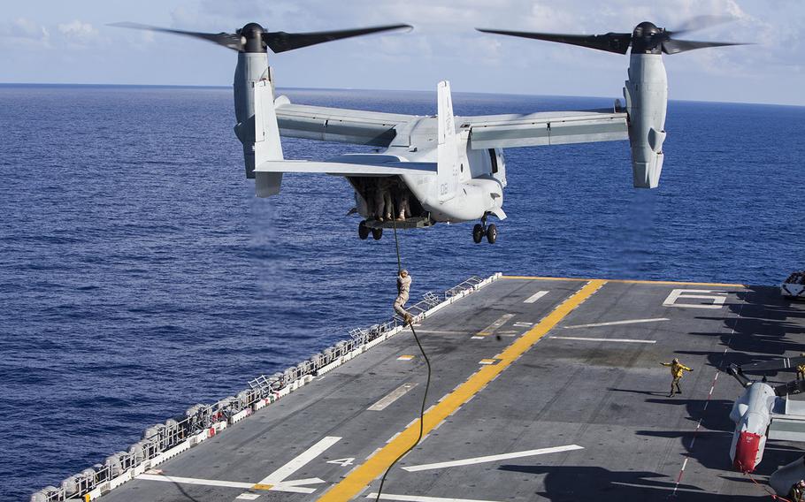 U.S. Marines with Battalion Landing Team 2nd Battalion, 5th Marines, 31st Marine Expeditionary Unit conduct fast-rope techniques from a MV-22 Osprey assigned to Marine Medium Tiltrotor Squadron 265 (Reinforced), 31st MEU aboard the USS Bonhomme Richard out at sea, on June 13, 2015.