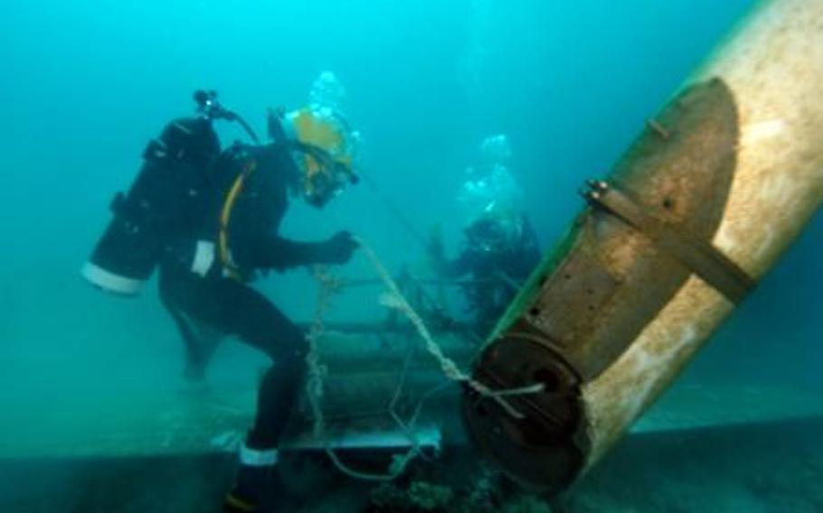 Divers assigned to Mobile Underwater Diving Salvage Unit 1 train near Pearl Harbor, Hawaii, in 2008. A Unit 1 team has been sent to the Philippines to aid in the search for victims of a plane crash Aug. 18, 2012. Among the missing was the Philippine interior secretary.