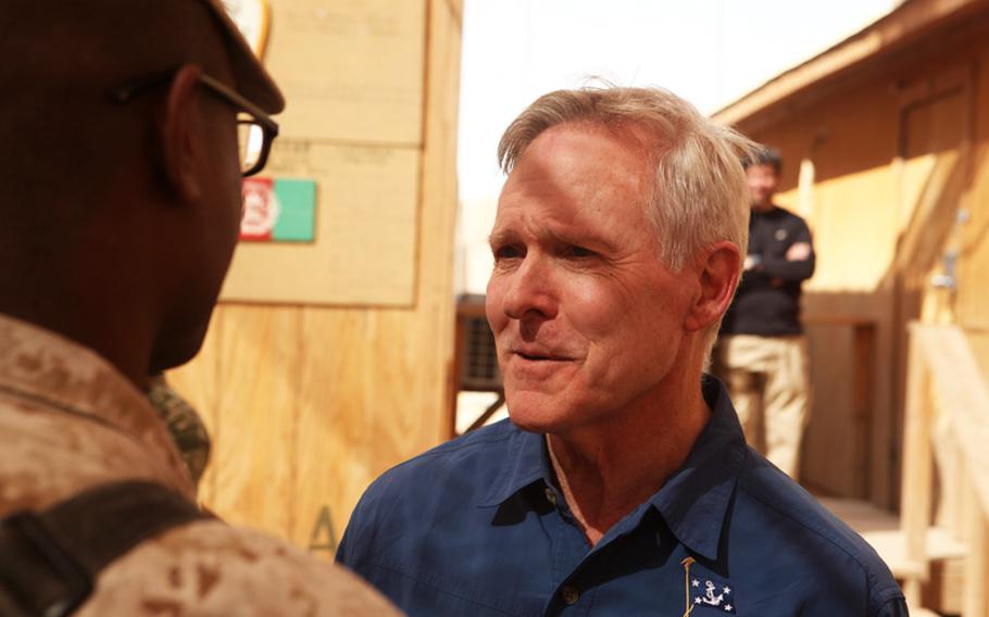 Secretary of the Navy Ray Mabus speaks to a Marine at Forward Operating Base Geronimo, Afghanistan, Oct. 28. The visit was Mabus's 10th to Helmand province since he assumed his current position as the 75th Secretary of the Navy.
