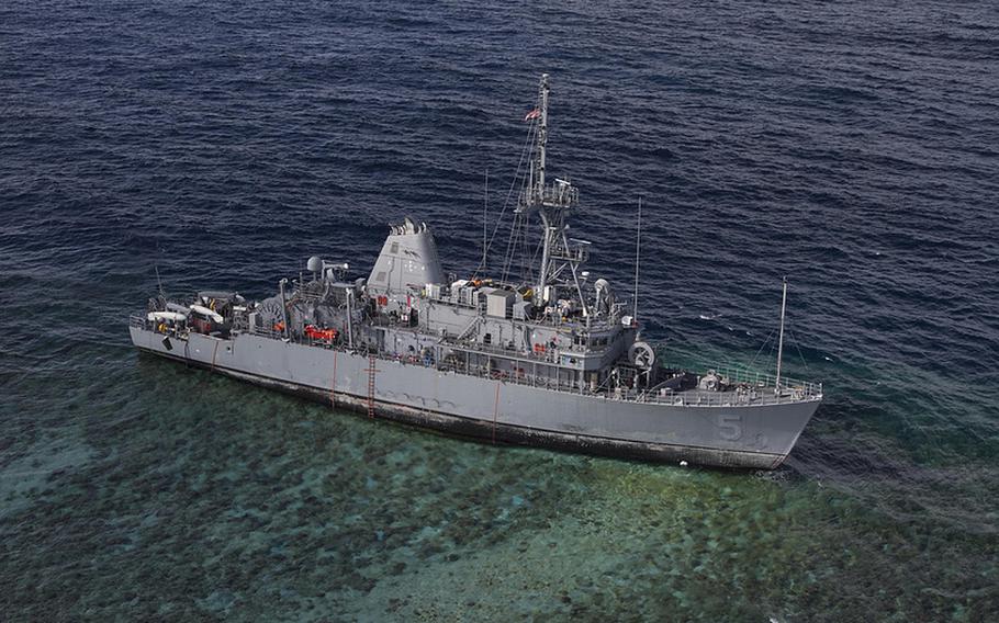 The USS Guardian sits aground on the Tubbataha Reef in the Philippines, Jan. 22, 2013. Work to cut up and remove the ship is expected to begin Friday. 