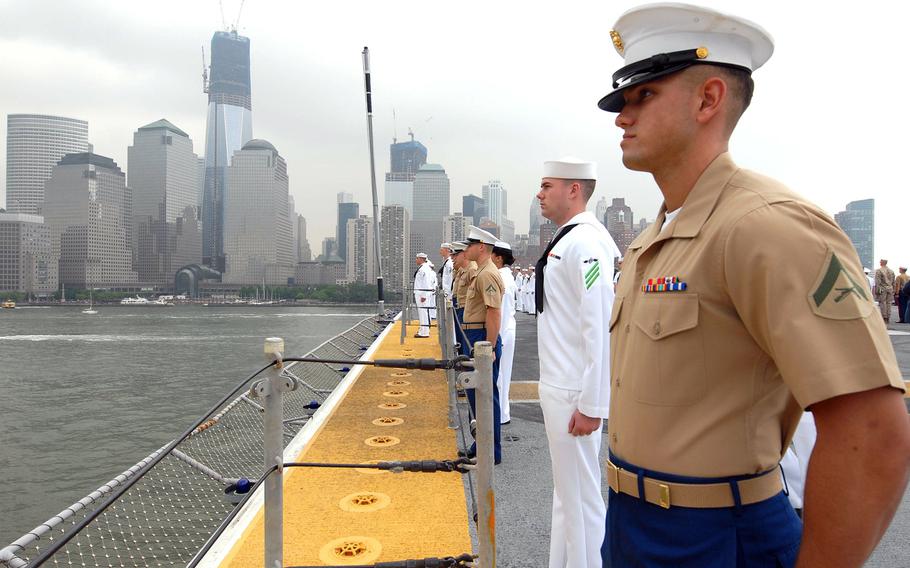 Sailors and Marines man the rails as the multipurpose amphibious assault ship USS Wasp transits the Hudson River on May 23, 2012, during the Parade of Ships as part of Fleet Week New York City 2012. 