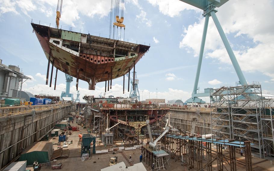 Sections of the aircraft carrier USS Gerald R. Ford are moved into position at Huntington Ingalls Newport News Shipbuilding in this 2011 photo.