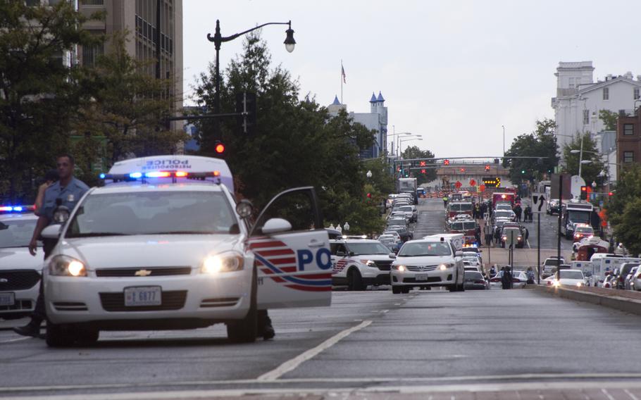 Police respond to the scene of a shooting at the Washington Navy Yard that left 12 people dead on Sept. 16, 2013.