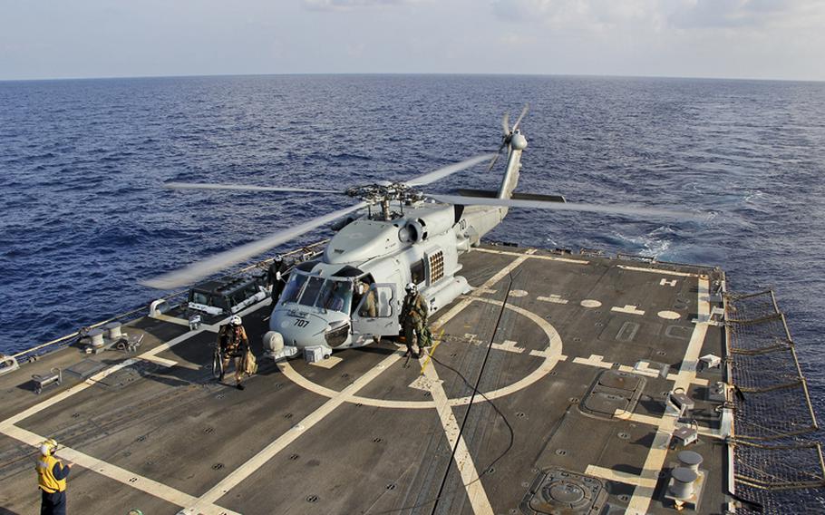 A U.S. Navy MH-60R Sea Hawk helicopter from Helicopter Maritime Strike Squadron 78, Det 2, assigned to the guided-missile destroyer USS Pinckney, lands aboard Pinckney during a crew swap before returning on task in the search and rescue for the missing Malaysian airlines flight MH370. The flight had 227 passengers from 14 nations, mainly China, and 12 crew members. According to the Malaysia Airlines website, three Americans, including one infant, were also aboard. 
