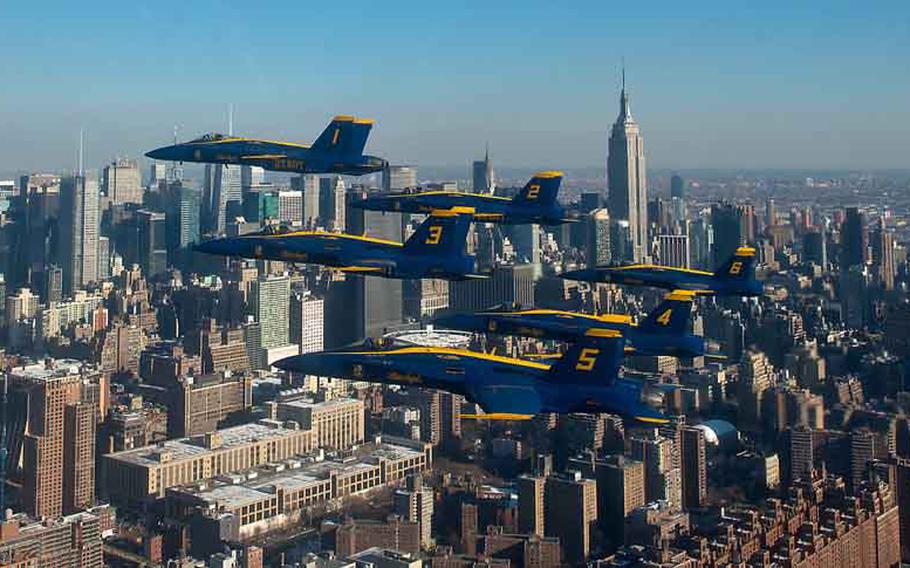 U.S. Navy Flight Demonstration Squadron, the Blue Angels, pilots fly in the world-renowned Delta Formation past the New York City skyline.  