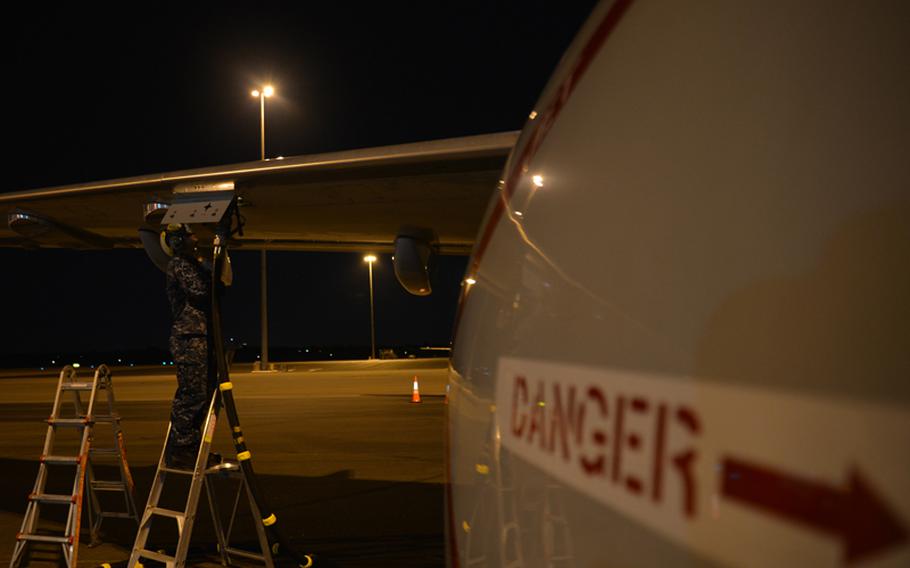 Airman Trevor Machell, a plane captain assigned to Patrol Squadron (VP) 16, fuels a P-8A Poseidon in Perth, Australia before a mission to assist in search and rescue operations for Malaysia Airlines flight MH370. VP-16 is  deployed in the U.S. 7th Fleet area of responsibility supporting security and stability in the Indo-Asia-Pacific region. 