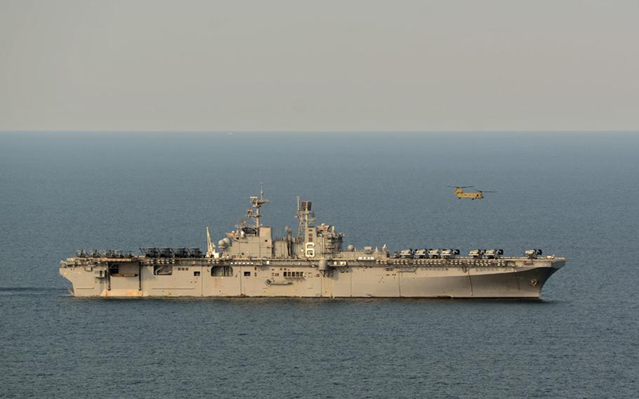 A CH-47F Chinook tandem rotor heavy-lift helicopter, assigned to the 3rd General Support Aviation Battalion, 2nd Infantry Division, conducts flight operations with the amphibious assault ship USS Bonhomme Richard (LHD 6). 
