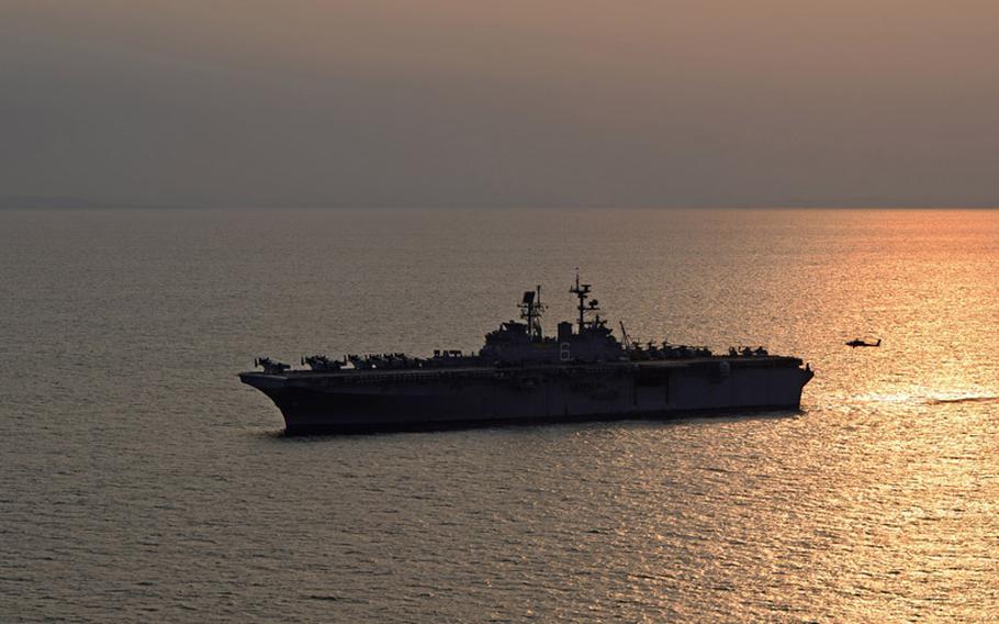 An AH-64D Apache Longbow attack helicopter assigned to the 4th Aerial Reconnaissance Battalion (Attack), 2nd Aviation Regiment, lands on the flight deck of the amphibious assault ship USS Bonhomme Richard (LHD 6) April 11, 2014.