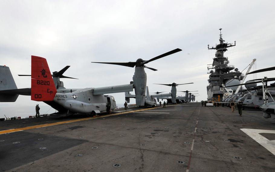 MV-22 Osprey tilt-rotor aircraft sit on the flight deck of the amphibious assault ship USS Bonhomme Richard on Wednesday, April 16, 2014. Bonhomme Richard was headed to the scene of the sinking of the South Korean passenger ferry Sewol to offer assistance in rescue and recovery efforts.