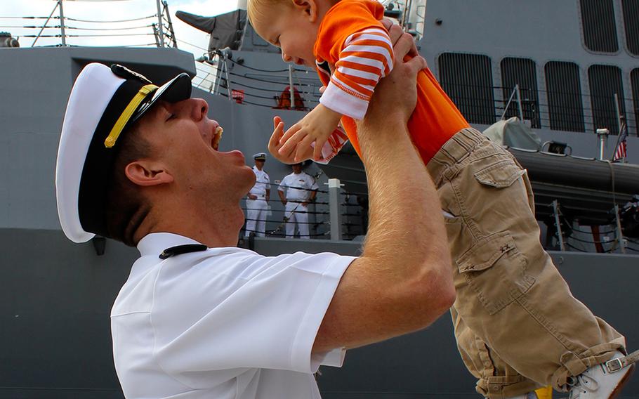 Lt. Kevin Walter plays with his 16-month-old son, Seamus, at Naval Base San Diego before boarding the USS Sampson on Friday, Oct. 31, 2014, for a deployment to the western Pacific. This is Walter's 3rd deployment but his 1st since becoming a father. 