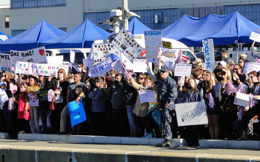 Families cheer as the USS Cape St. George, a Ticonderoga-class guided missile cruiser, pulls up to the pier at Naval Base San Diego on Friday, Jan. 16, 2015. The ship was returning from a 7-month deployment to the western Pacific Ocean. 'I cannot be prouder of the professionalism of my crew,' said the ship's commanding officer, Capt. Michael P. Doran.