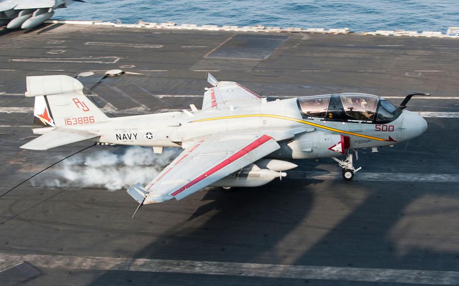 An EA-6B Prowler assigned to the Garudas of Electronic Attack Squadron (VAQ) 134 lands on the flight deck of the aircraft carrier USS George H.W. Bush. George H.W. Bush is supporting maritime security operations, strike operations in Iraq and Syria as directed, and theater security cooperation efforts in the U.S. 5th Fleet area of responsibility.