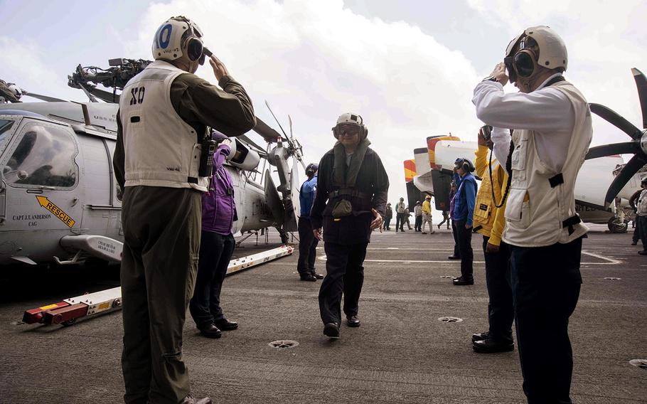 Karnig Ohannessian, Deputy Assitant Secretary of the Navy for Environment, is welcomed aboard the aircraft carrier USS Dwight D. Eisenhower on April 2, 2016.