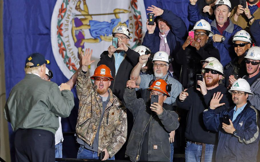 President Donald Trump acknowledges the crowd after speaking abroad the aircraft carrier Gerald R. Ford at Newport News Shipbuilding, March 2, 2017.