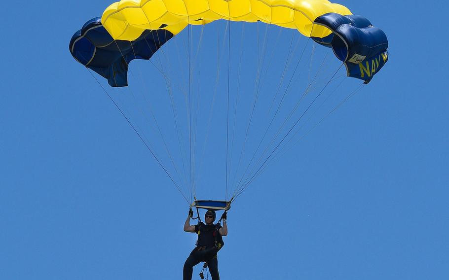 Petty Officer 1st Class Remington Peters, a member of the U.S. Navy Parachute Team, the Leap Frogs, comes in for a landing during a demonstration at the Dayton Air Show. 