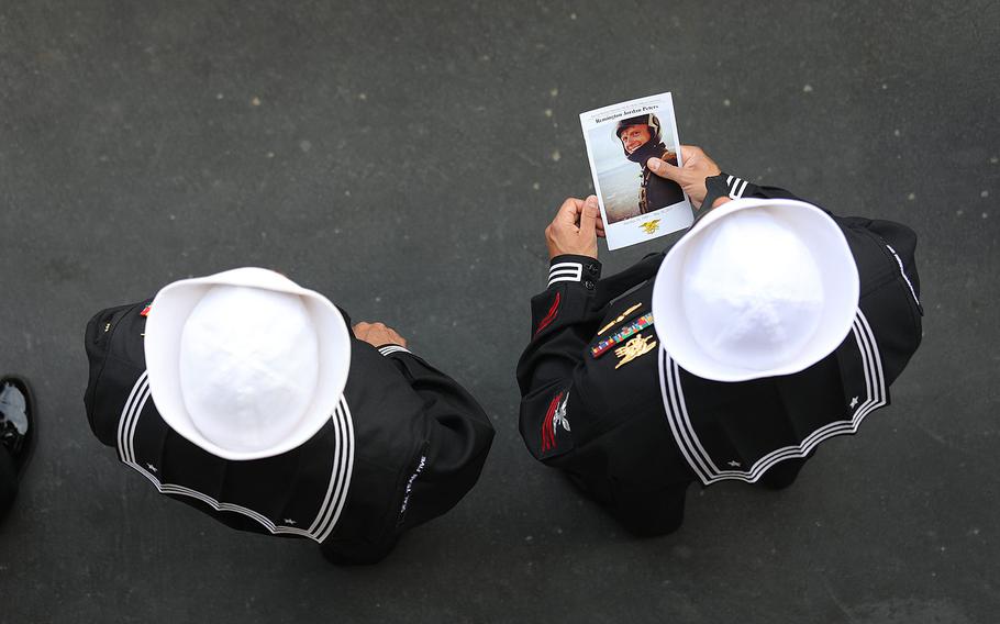 Sailors attend a memorial ceremony for Petty Officer 1st Class (SEAL) Remington Peters at Naval Amphibious Base Coronado, Calif., on June 2, 2017.