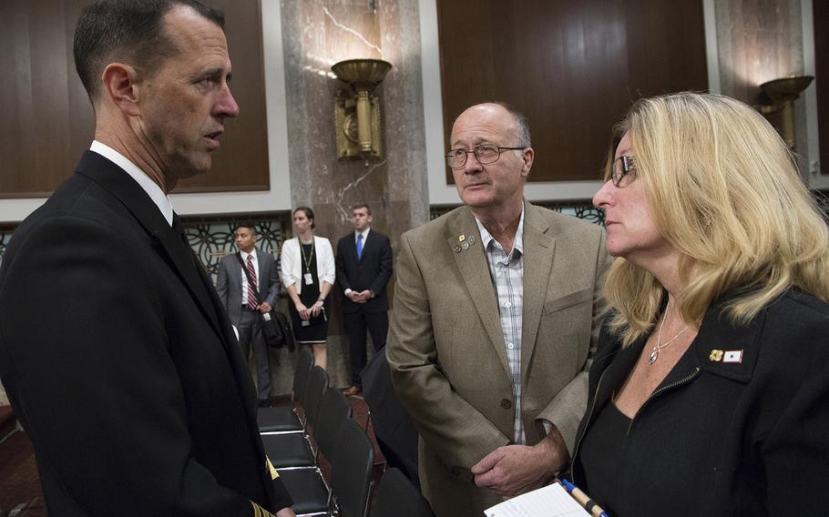 Chief of Naval Operations Adm. John M. Richardson talks with Sid and Theresa Palmer of Decatur, Ill., parents of Petty Officer 3rd Class Logan Palmer, before a Senate Armed Services Committee hearing on Capitol Hill, Sept. 19, 2017. Logan Palmer was one of 10 sailors who died in a collision between the USS John McCain and a tanker near Singapore on August 21.